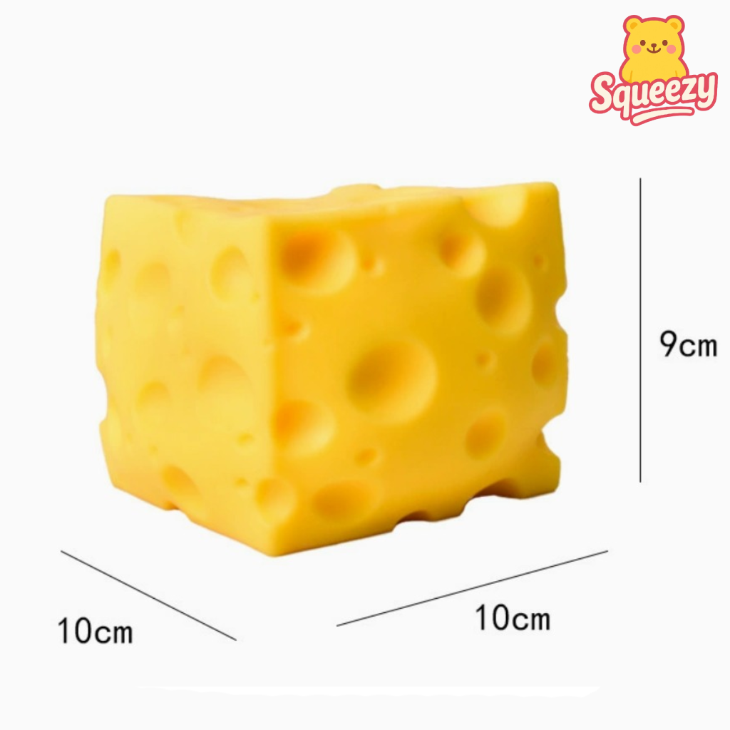 Yellow cheese-shaped squishy toy with dimensions and 'Squeezy' branding.
