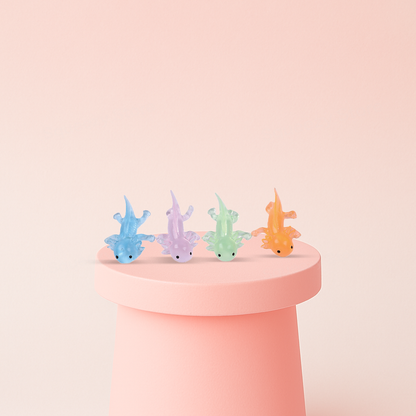 Axolotl Squishies soft EVA stress relief toy in translucent blue, purple, green, and orange axolotl designs.