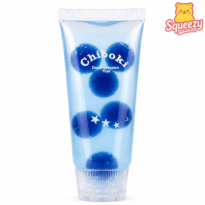 Blue Chiboki glitter stress toy filled with sparkling stars inside a transparent sensory squeeze tube.