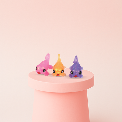 Chameleon with Maltose soft EVA stress relief toy in pink, orange, and purple translucent chameleon designs.