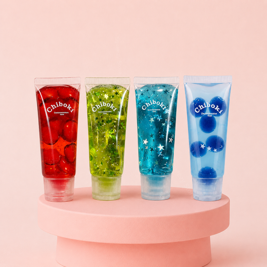 Collection of colorful Chiboki glitter gel stress toys displayed on a pink stand with red, green, and blue sensory gel tubes.