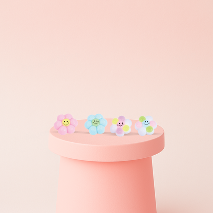 Colorful Flower Squishies in assorted pastel flower designs with cheerful smiling faces.