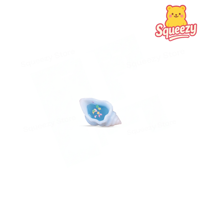 Conch Squishy soft stress relief toy designed as a white conch shell with ocean-themed details inside.
