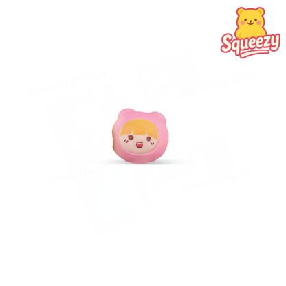 Cute Squishy soft EVA stress relief toy with blonde hair and pink hood.