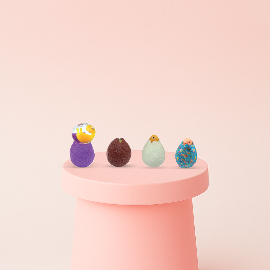 Dinosaur Egg stress relief toys featuring colorful egg-shaped designs, including glitter-filled eggs and cracked eggs with baby dinosaurs.