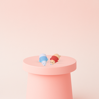 EVA Bear Wearing Shirt displayed on a pastel stand, soft bear sensory toy for stress relief.