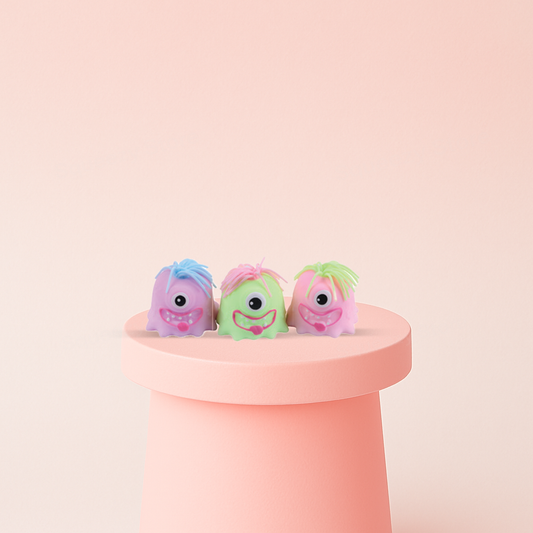 EVA Monster soft squeezable stress relief toys in pink, green, and purple colors.