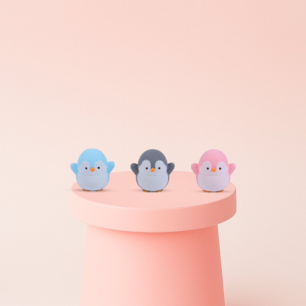 EVA Lovely Penguin soft penguin stress relief toy in pastel blue, gray, and pink colors.
