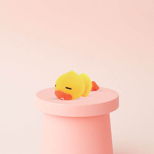 EVA Lying Down Duck soft sensory toy with orange beak and relaxed sleeping expression.