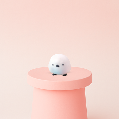 EVA Titmouse soft sensory toy with white body, tiny black eyes, and small blue beak.