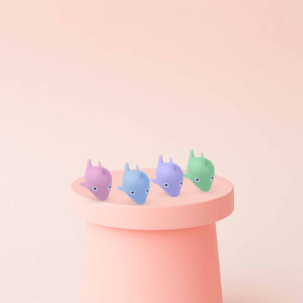 EVA Whale soft EVA stress relief toy in pastel purple, pink, blue, and green whale designs.