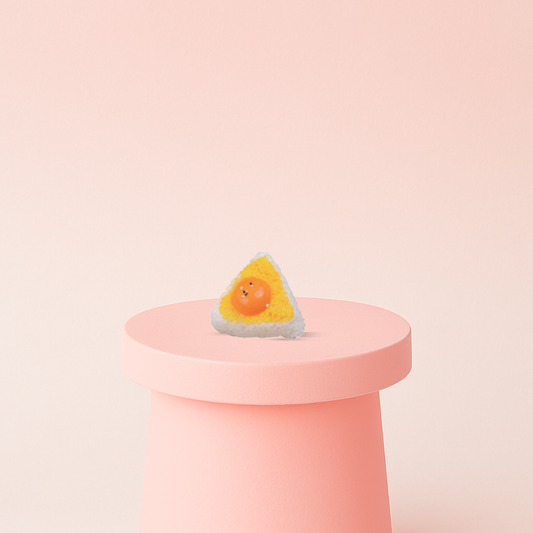 Egg Yolk Rice Roll Squishies display box featuring triangle rice ball stress relief toys with smiling egg yolks.