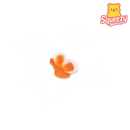 Egg Squishy soft stress relief toy designed as a realistic fried egg with glossy yolk and white egg base.