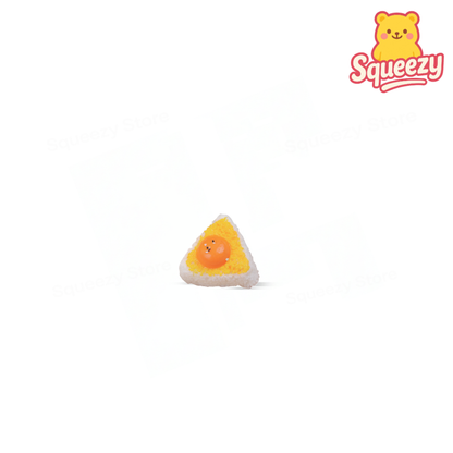 Egg Yolk Rice Roll Squishy soft stress relief toy designed as a kawaii rice ball with textured rice details and a cheerful egg yolk face.
