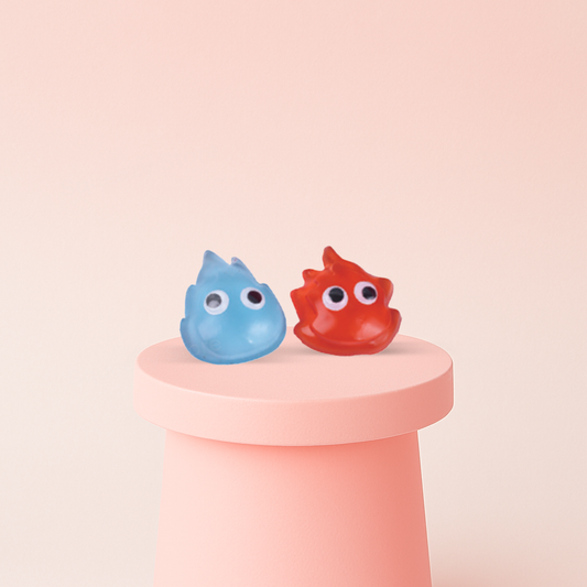 Flame-Shaped Squishies in red and blue droplet-shaped character designs with googly eyes.