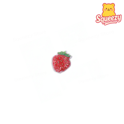 Strawberry-shaped product with a bear character labeled 'Squeezy' on a white background