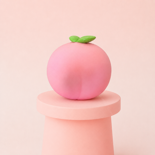 Giant Peach Squishy jumbo pink stress relief toy displayed on a pink stand with cute green leaves.