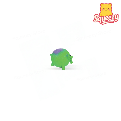 Green Little Dinosaur soft EVA stress relief toy with purple spots and dinosaur shape.