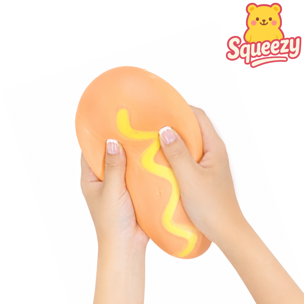 Hands squeezing the Keycraft Jumbo Hot Dog slow rising squishy stress relief toy with realistic bun and mustard topping