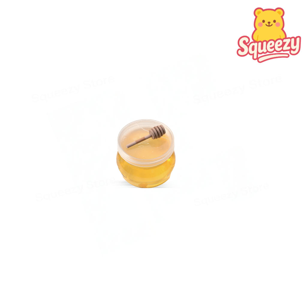 Honey Slime soft and stretchy golden slime packaged in a realistic honey jar container with a miniature honey dipper.