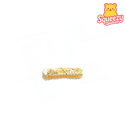 Honey Stick Squishy soft stress relief toy designed as a realistic honeycomb dessert bar with creamy topping details.
