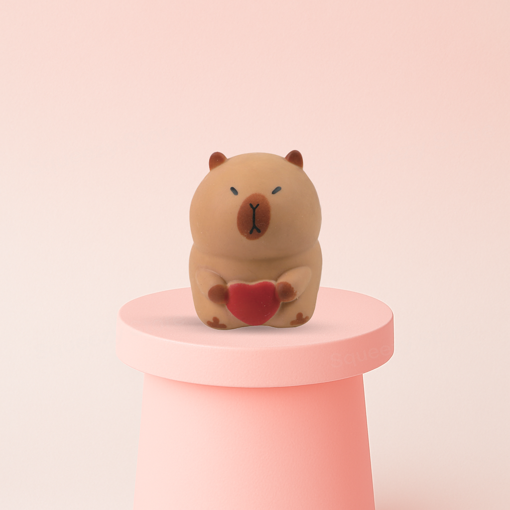 Jumbo Capybara with Heart super soft slow-rising stress relief toy holding a red heart.