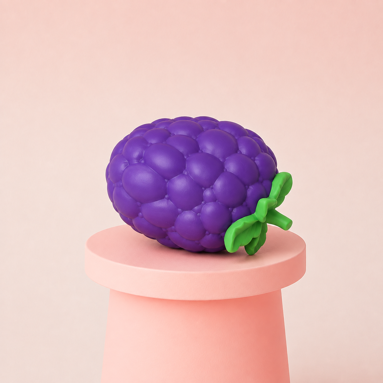 Jumbo Grape Squishy displayed on a pink pedestal featuring realistic purple grape texture and green leaves