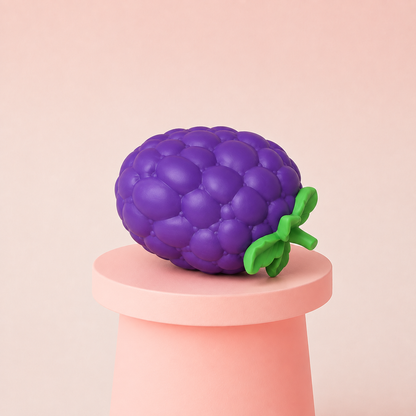 Jumbo Grape Squishy displayed on a pink pedestal featuring realistic purple grape texture and green leaves
