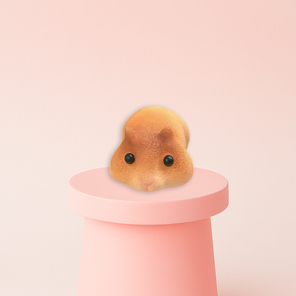 Jumbo Lying Hamster Squishy displayed on a pastel stand, ultra-soft slow-rising sensory toy for stress relief.