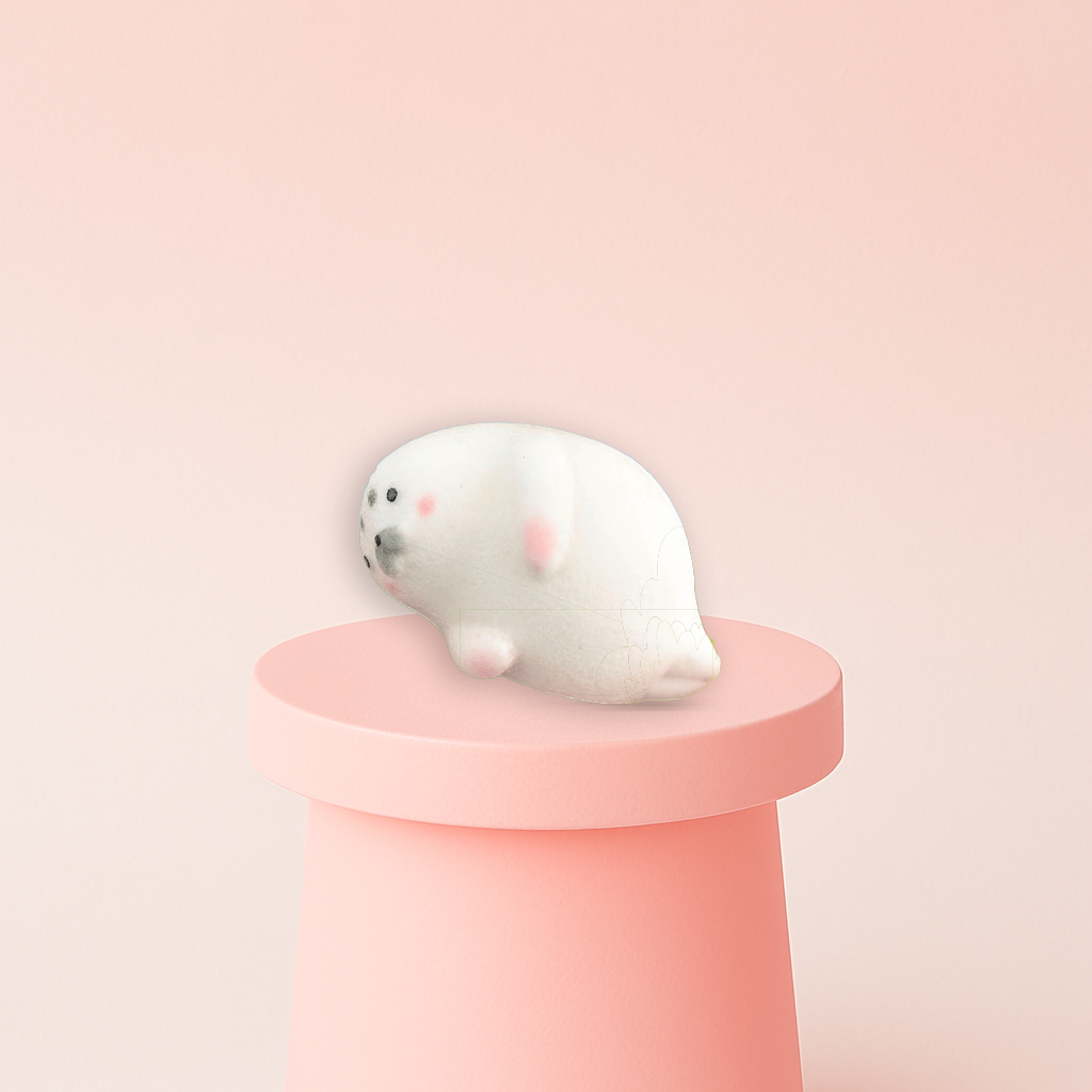 Jumbo Seal Squishy displayed on a pastel stand, super soft slow-rising sensory toy for stress relief.