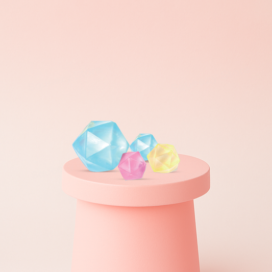 Maltose Squishy Diamond crystal gem stress relief toys in blue, pink, and yellow translucent colors.