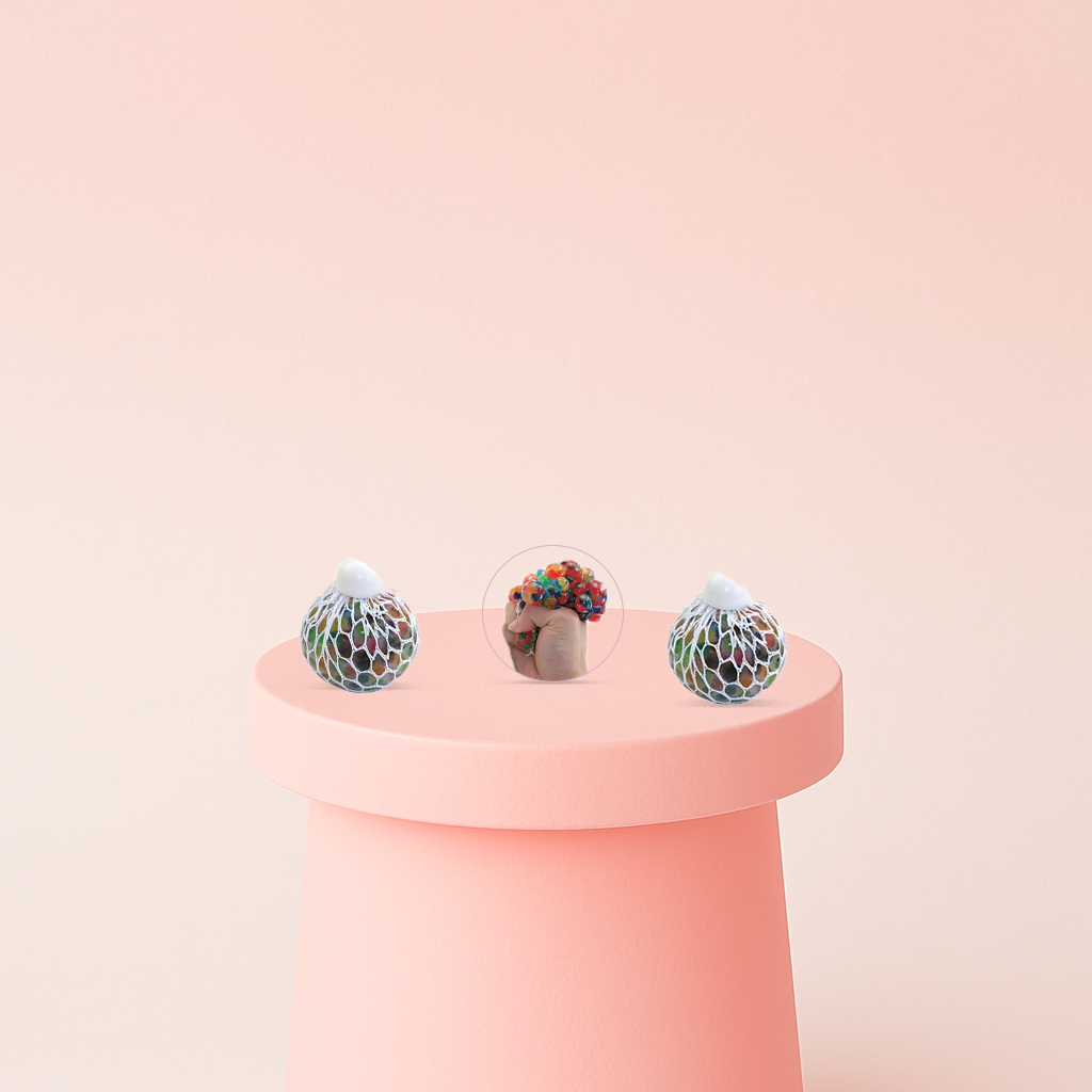 Mesh Ball with Beads being squeezed in a hand, showing colorful bead-filled bubbles expanding through the mesh.