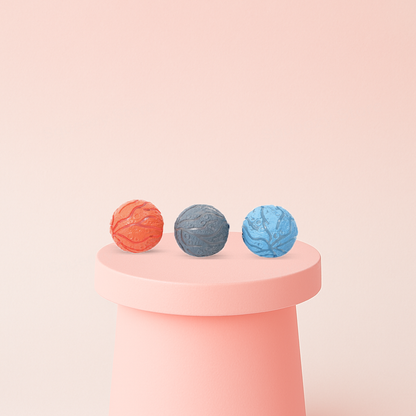 Meteorite Stress Ball textured stress relief toys in orange, gray, and blue with crater-like planet designs.