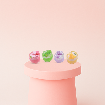 Milkshake Squishies collection featuring pastel mini milkshake cups in green, purple, pink, and yellow.