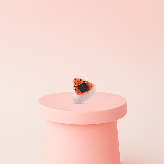 Nori Rice Ball Squishy shaped like a realistic Japanese rice ball with salmon topping and seaweed square.