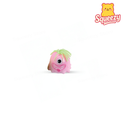 Pink EVA Monster soft one-eyed stress relief toy with rainbow hair.
