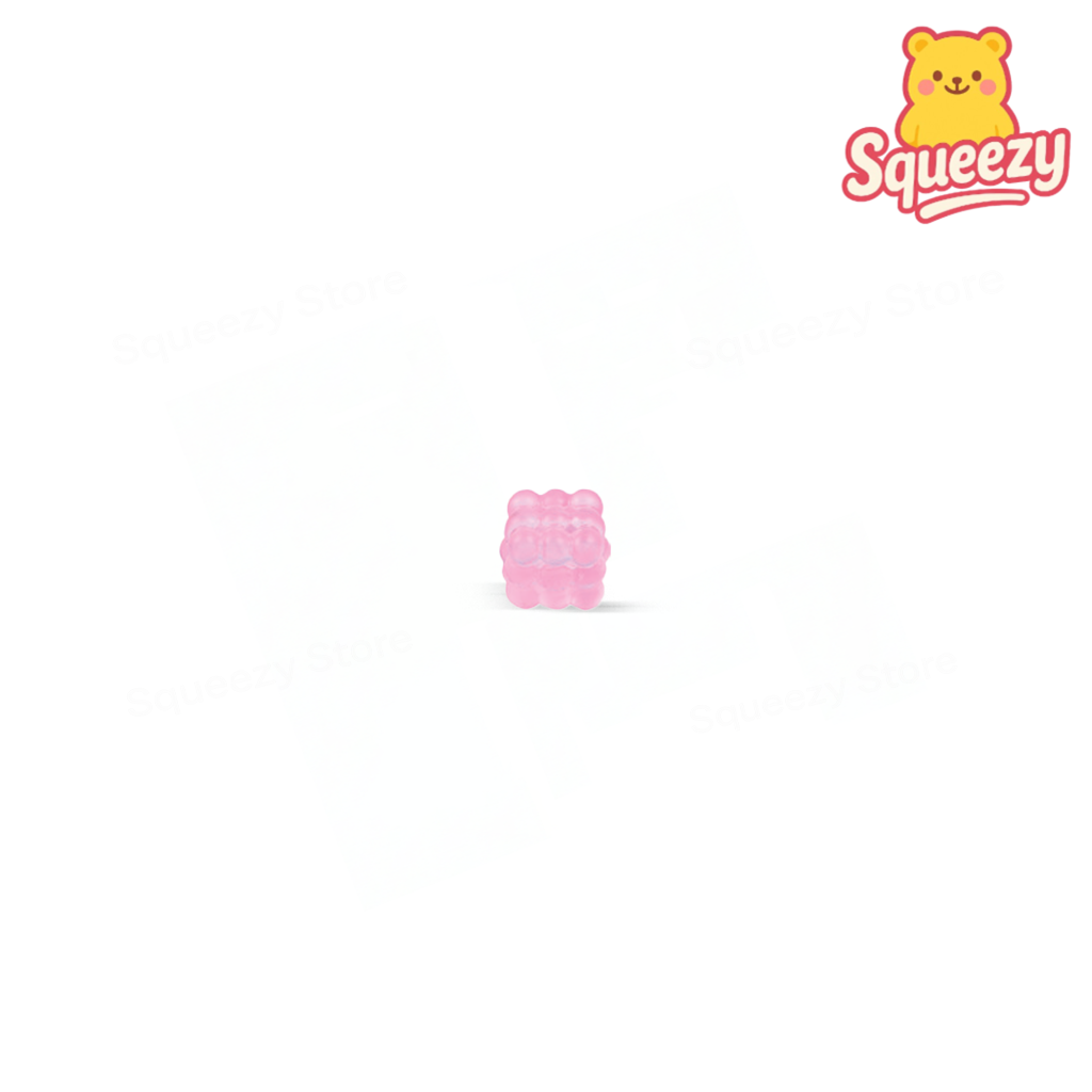 Pink Marshmallow Maltose Cube glitter-filled cube sensory toy.