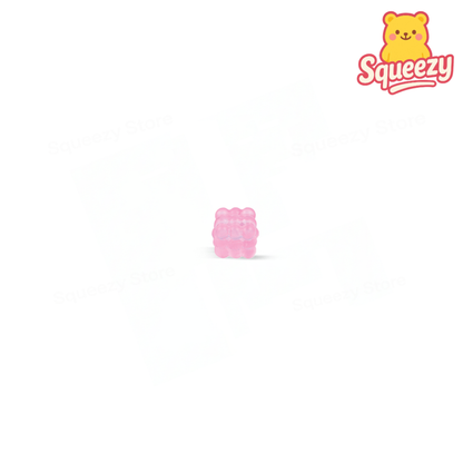 Pink Marshmallow Maltose Cube glitter-filled cube sensory toy.