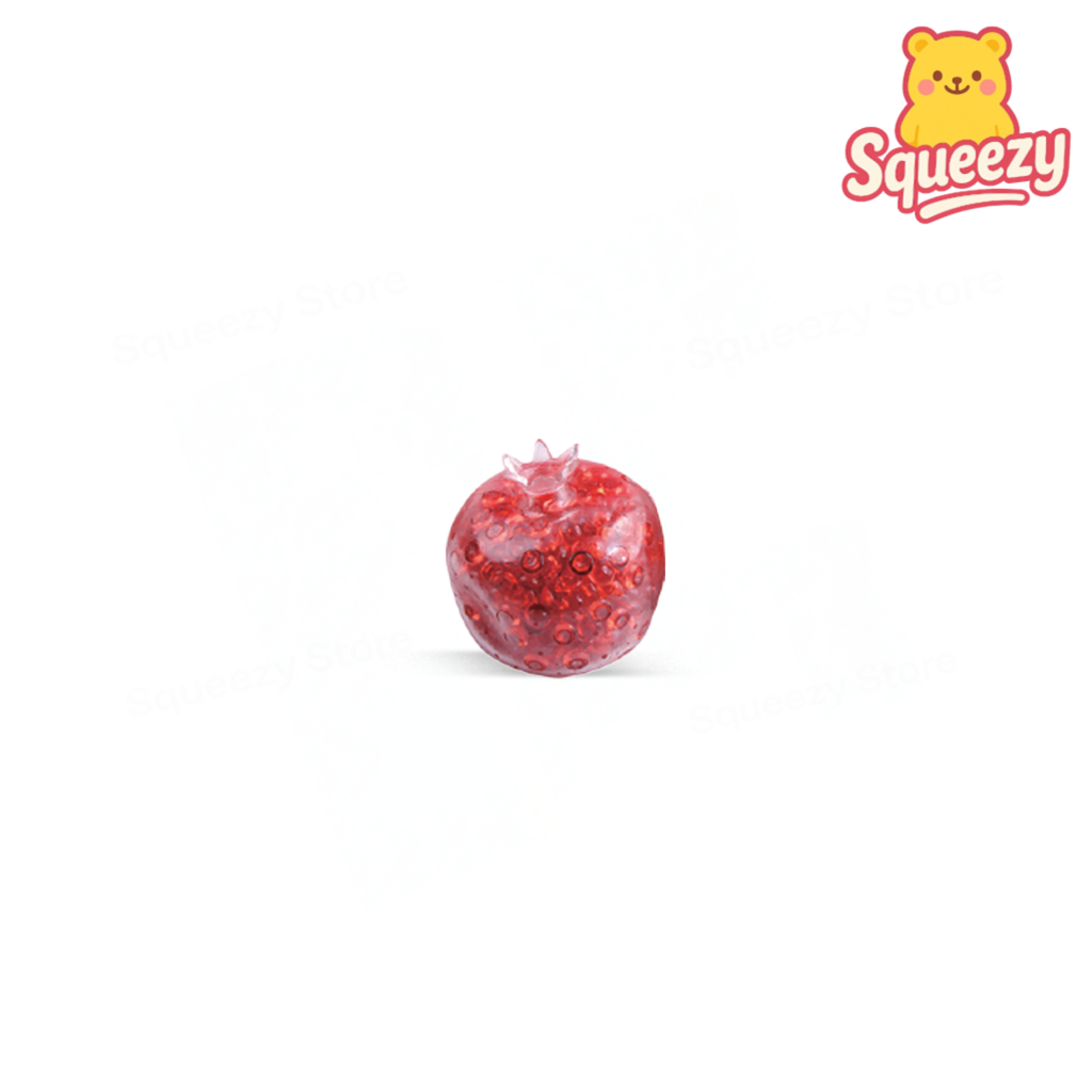 Pomegranate Ball squeezable stress relief toy shaped like a red pomegranate with a crown top and glitter-filled interior.