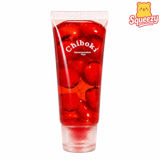 Red Chiboki glitter gel stress toy filled with floating red beads inside a transparent squeeze tube.