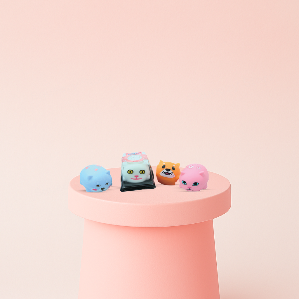 Shiba & Cat Squishies in blue, gray, orange, and pink animal designs.