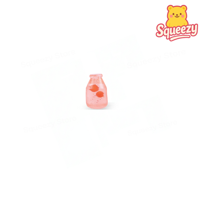 Small pink bottle with a bear design on a white background, featuring the brand 'Squeezy'.