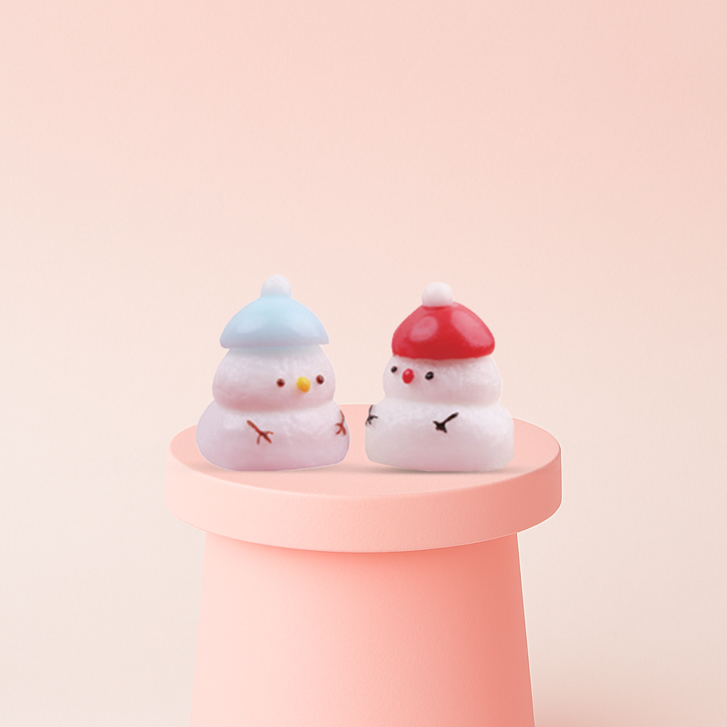 Snow Man Squishies with blue and red hats, super soft slow-rising winter stress relief toys.