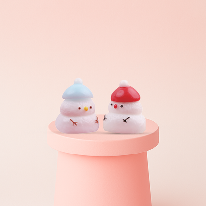 Snow Man Squishies with blue and red hats, super soft slow-rising winter stress relief toys.