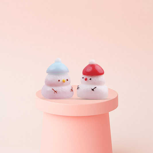 Snow Man Squishies with blue and red hats, super soft slow-rising winter stress relief toys.