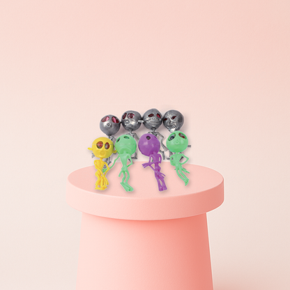 Squishy Alien soft EVA stress relief toys in silver, yellow, green, purple, and blue alien designs.