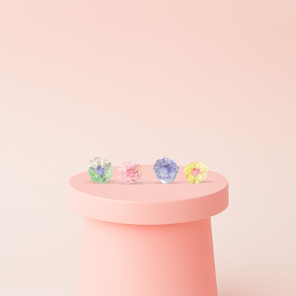 Squishy Bracelet wearable flower-shaped stress relief toys in pink, yellow, green, and purple colors.