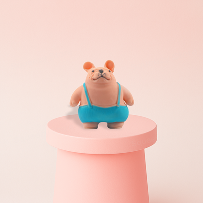 Squishy Bully Dog displayed on a pastel stand, soft slow-rising sensory toy for stress relief.