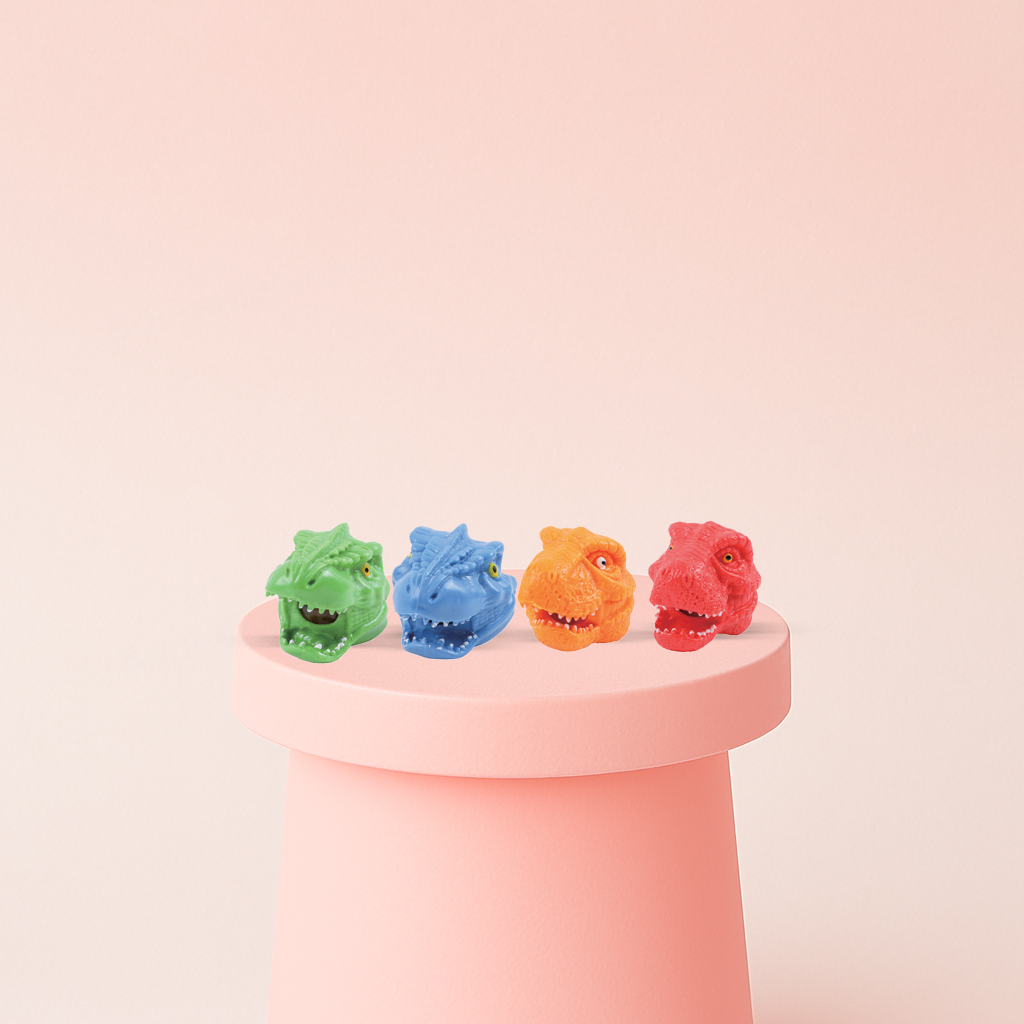Squishy Dino Head with Beads soft EVA stress relief toy in green, blue, orange, and red dinosaur head designs.