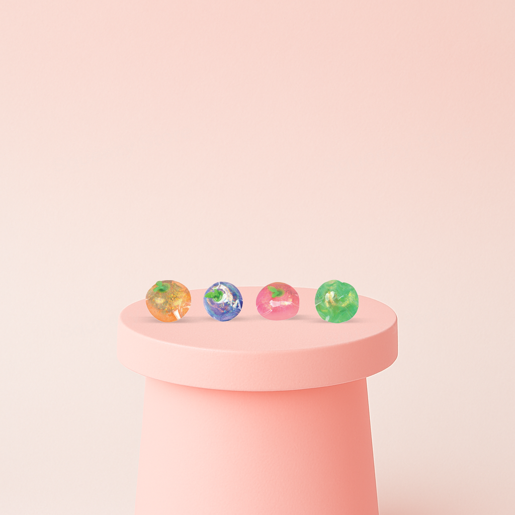 Squishy Fruits with Maltose collection featuring colorful round fruit-shaped squishies filled with sparkling glitter.